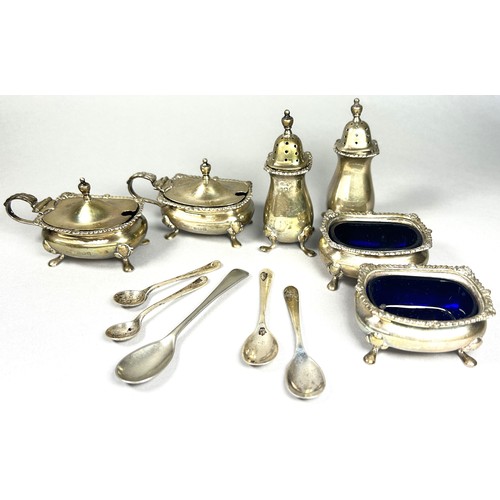 294 - A silver condiment set to include two salt and two peppers pots, two mustard pots and a selection of... 