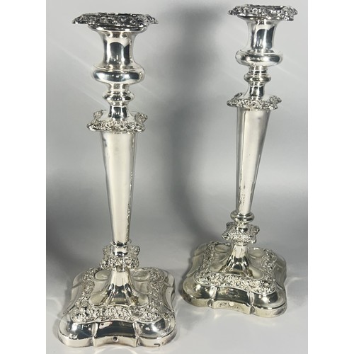 252A - A Pair of silver plated  Georgian style candlesticks with removable sconces 34.5cm high.