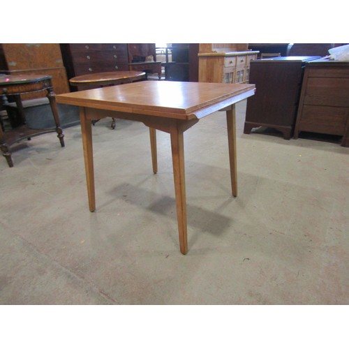 1207 - A vintage 1970's G-Plan draw leaf table, 76cm high x 136cm open, x 76cm together with a set of four ... 