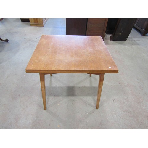 1207 - A vintage 1970's G-Plan draw leaf table, 76cm high x 136cm open, x 76cm together with a set of four ... 