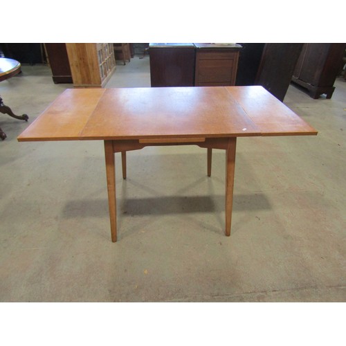 1207 - A vintage 1970's G-Plan draw leaf table, 76cm high x 136cm open, x 76cm together with a set of four ... 