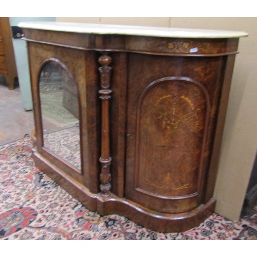 1388 - A Victorian figured walnut credenza with serpentine shaped sides enclosing an arched mirror panelled... 