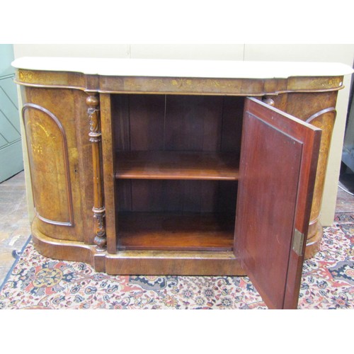 1388 - A Victorian figured walnut credenza with serpentine shaped sides enclosing an arched mirror panelled... 