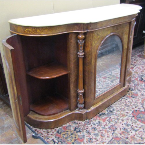 1388 - A Victorian figured walnut credenza with serpentine shaped sides enclosing an arched mirror panelled... 