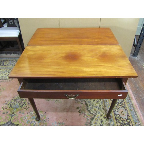 1401 - A Georgian mahogany fold over top tea table, raised on four pad feet, enclosing a frieze drawer, 94c... 