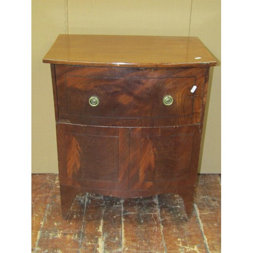 1407 - A mahogany bow front commode on swept supports