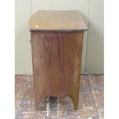 1407 - A mahogany bow front commode on swept supports