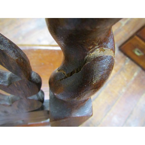 1409 - Two 19th century carved oak hall chairs in a carolean style