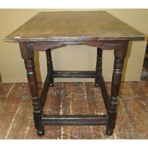 1417 - An old English oak centre table with plank top on turned supports, 95cm x 66cm x 82cm high