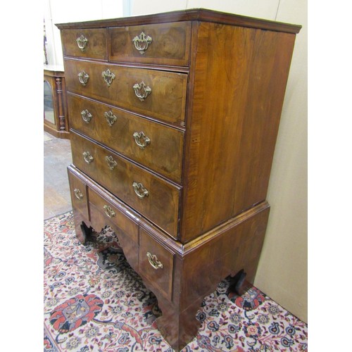 1423 - An 18th century walnut chest on stand, the chest with three long and two short graduated drawers, th... 