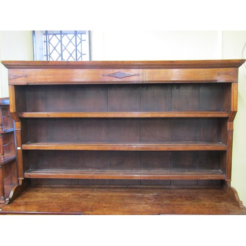 1427 - A Georgian Welsh oak breakfront dresser, the T shaped arrangement of six drawers flanked by two cupb... 