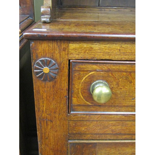 1427 - A Georgian Welsh oak breakfront dresser, the T shaped arrangement of six drawers flanked by two cupb... 