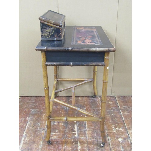 1428 - A Victorian bamboo framed and black lacquered writing desk with raised stationery blocks, 74cm wide