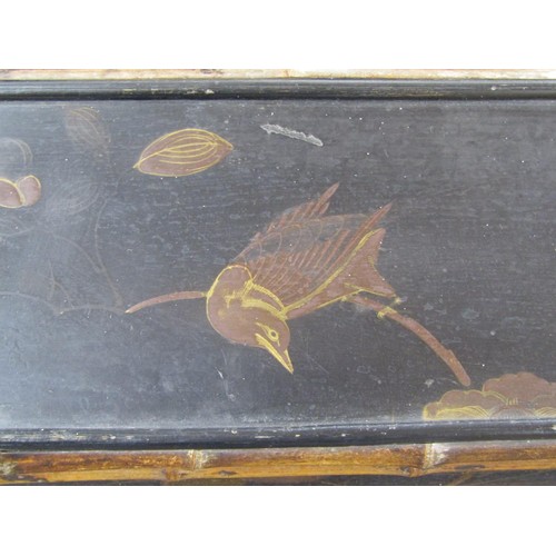 1428 - A Victorian bamboo framed and black lacquered writing desk with raised stationery blocks, 74cm wide