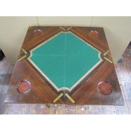 1430 - An Edwardian rosewood envelope top card table of usual form with inlaid detail, frieze drawer and sq... 