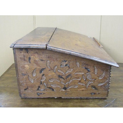 1442 - A 17th century oak writing slope, with floral and bird marquetry inlay (some missing), the sloping t... 