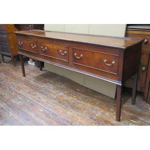 1443 - A George III oak sideboard enclosing three frieze drawers on square tapered supports, 83cm high x  2... 