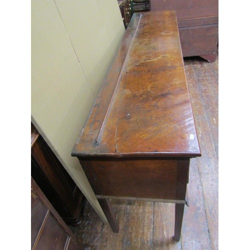 1443 - A George III oak sideboard enclosing three frieze drawers on square tapered supports, 83cm high x  2... 