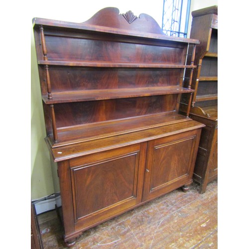 1449 - A Georgian mahogany side cabinet the lower section enclosed by a pair of panelled doors, the upper w... 