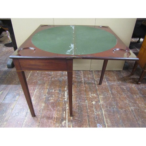 1450 - A Georgian mahogany fold over top card table of rectangular form, the circular baize lined interior ... 