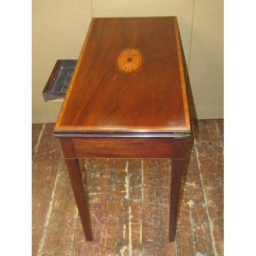 1450 - A Georgian mahogany fold over top card table of rectangular form, the circular baize lined interior ... 