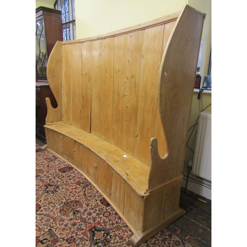 1455 - A very substantial Georgian bacon settle of concave outline, in stripped pine with elm sides and sea... 