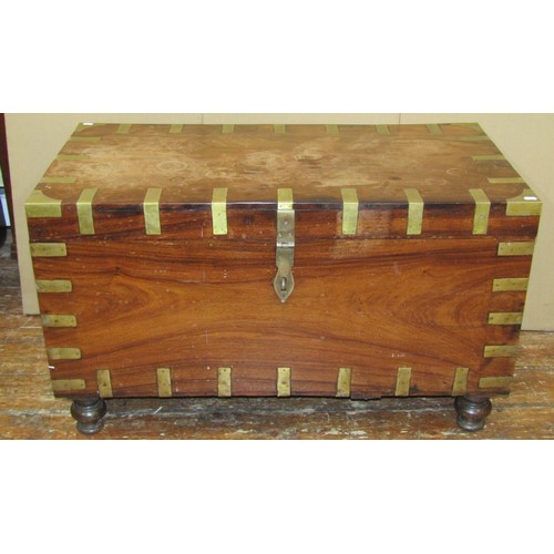 1456 - A 19th century Anglo-Indian hardwood chest with inset brass banding, raised on turned supports, 62cm... 