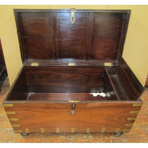 1456 - A 19th century Anglo-Indian hardwood chest with inset brass banding, raised on turned supports, 62cm... 