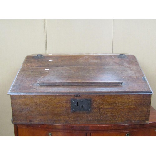 1459 - A 17th century oak writing slope, the rising lid enclosing four small drawers, with steel butterfly ... 