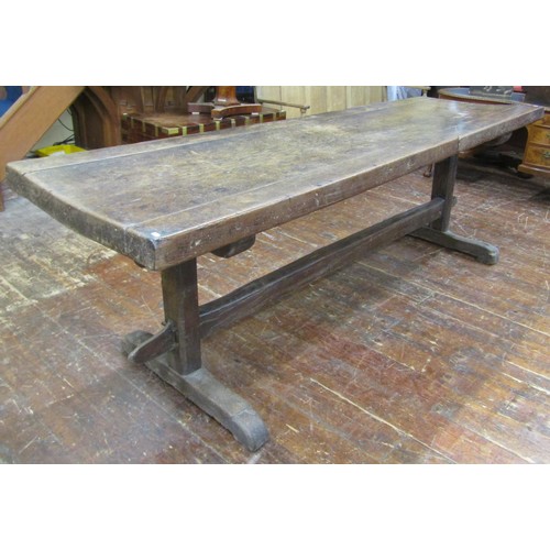 1461 - An early English oak refectory table, the massive top raised on a simple pegged stretcher base, the ... 