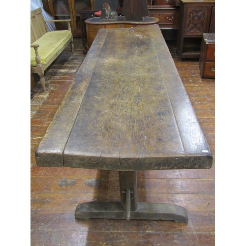 1461 - An early English oak refectory table, the massive top raised on a simple pegged stretcher base, the ... 