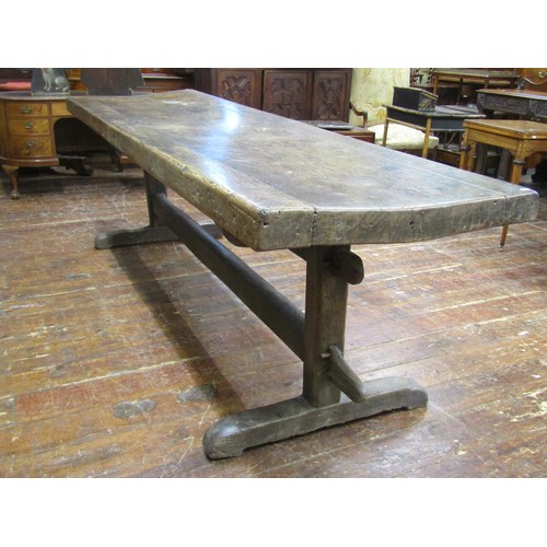 1461 - An early English oak refectory table, the massive top raised on a simple pegged stretcher base, the ... 