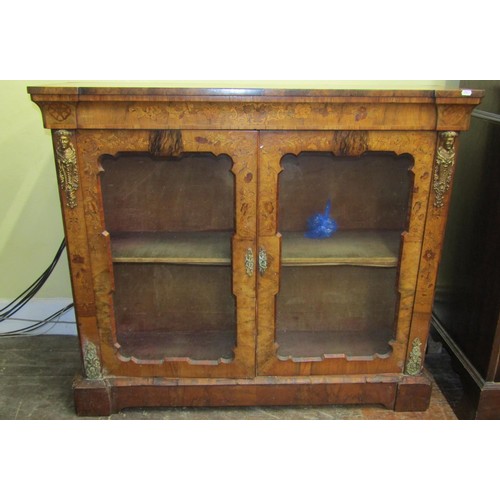 1468 - A Victorian walnut and floral marquetry pier cabinet enclosed by two glazed panelled doors with appl... 