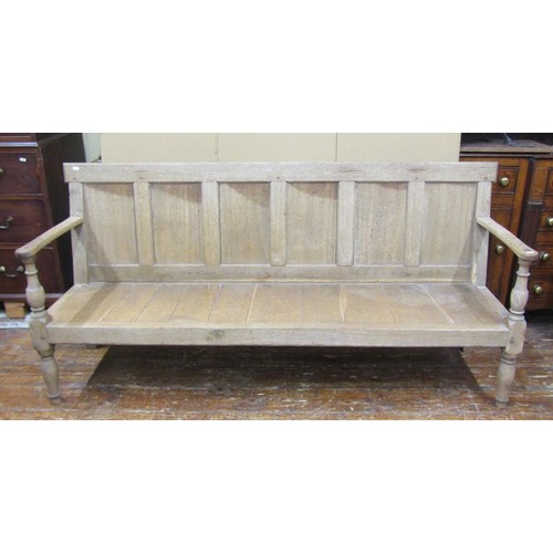 1471 - A Georgian bleached oak settle with panelled back and turned supports, 95cm high x 185cm x 65cm