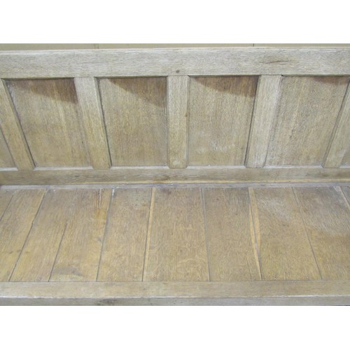 1471 - A Georgian bleached oak settle with panelled back and turned supports, 95cm high x 185cm x 65cm