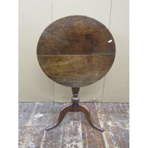 1472 - A Georgian oak country made snap top table on turned pillar and tripod, the top 69cm diameter