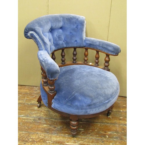 1475 - A Victorian walnut tub chair with turned spindle mouldings and later upholstered finish