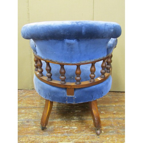 1475 - A Victorian walnut tub chair with turned spindle mouldings and later upholstered finish