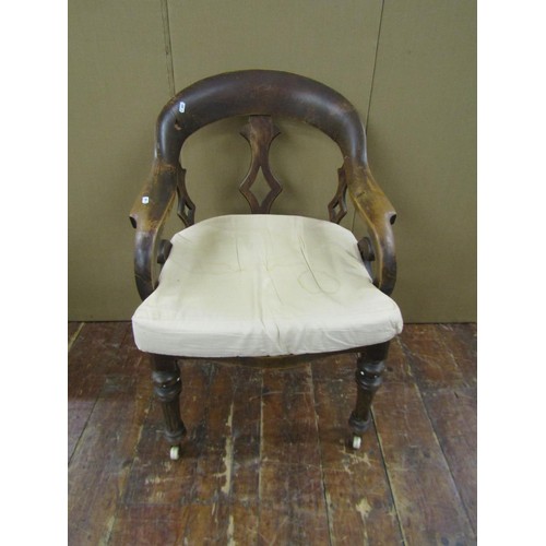 1476 - A Victorian office chair principally in beech wood, on fluted supports, with cane panelled seat (af)