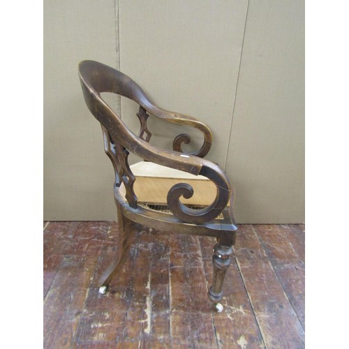 1476 - A Victorian office chair principally in beech wood, on fluted supports, with cane panelled seat (af)