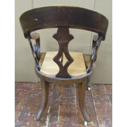 1476 - A Victorian office chair principally in beech wood, on fluted supports, with cane panelled seat (af)