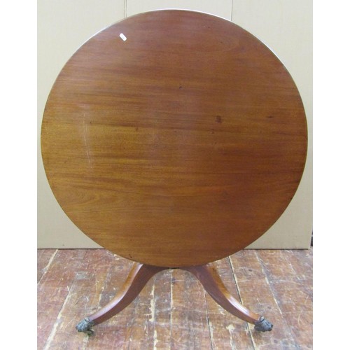 1477 - A Regency mahogany circular tilt top breakfast table, 100cm diameter top, raised on a turned column ... 