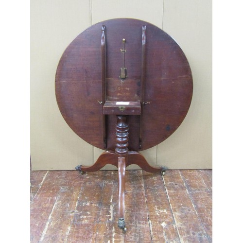 1477 - A Regency mahogany circular tilt top breakfast table, 100cm diameter top, raised on a turned column ... 