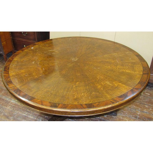 1478 - A substantial Regency centre table, the circular top with segmented oak veneers, within a wide bande... 