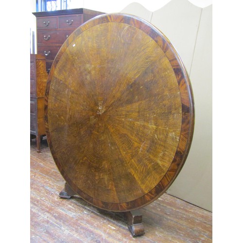 1478 - A substantial Regency centre table, the circular top with segmented oak veneers, within a wide bande... 