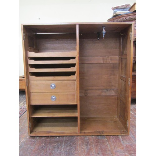 1482 - A fine quality Cotswold school fitted wardrobe in pale English walnut, the paneled frame enclosed by... 