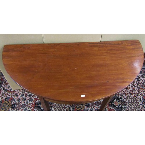 1400 - A mahogany demi-lune table raised on tapering square cut supports, 60cm (max deep) x 130cm x 73cm hi... 