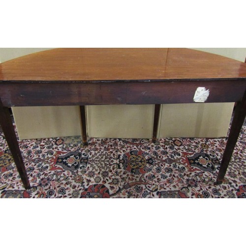 1400 - A mahogany demi-lune table raised on tapering square cut supports, 60cm (max deep) x 130cm x 73cm hi... 