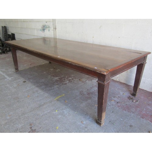 1550 - A large oak dining table, raised on tapering squared supports, 76 cm high, 276 x 121 cm.