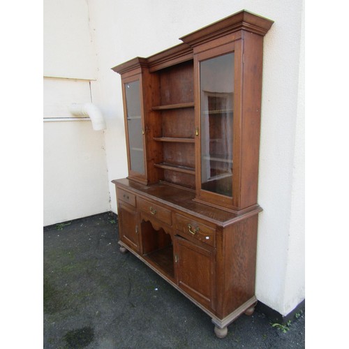 1546 - An Edwardian oak kitchen dresser and plate rack, fitted with glazed hinged doors, 205cm high, 159 x ... 